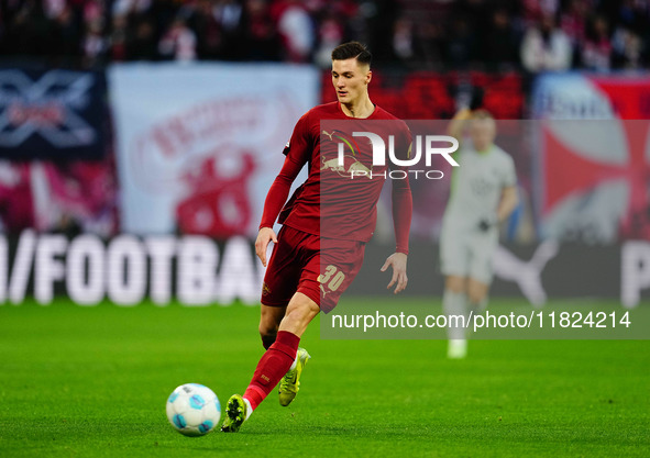 Benjamin Sesko of RB Leipzig  controls the ball during the Bundesliga match between RB Leipzig and VfL Wolfsburg at Red Bull Arena, Leipzig,...