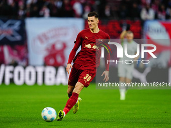 Benjamin Sesko of RB Leipzig  controls the ball during the Bundesliga match between RB Leipzig and VfL Wolfsburg at Red Bull Arena, Leipzig,...