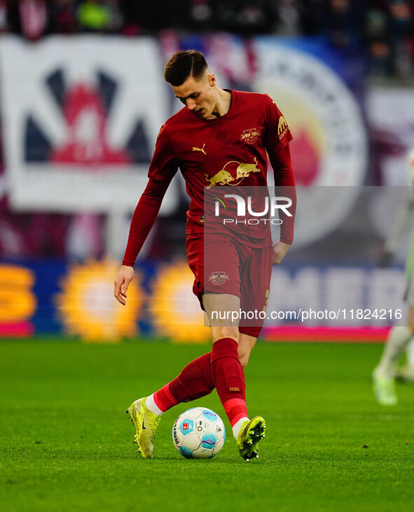 Benjamin Sesko of RB Leipzig  controls the ball during the Bundesliga match between RB Leipzig and VfL Wolfsburg at Red Bull Arena, Leipzig,...