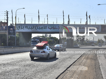 Following the ceasefire agreement between Israel and Lebanon, residents of the southern Lebanese city of Nabatieh return to their homes on N...