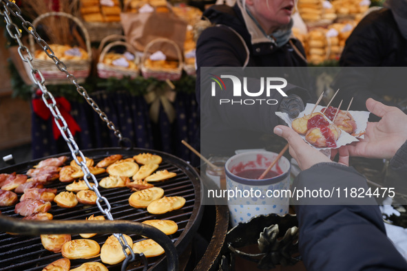 Traditional 'Oscypek' cheese, a smoked cheese made of salted sheep milk exclusively in the Tatra Mountains region, is sold at Christmas mark...