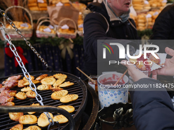 Traditional 'Oscypek' cheese, a smoked cheese made of salted sheep milk exclusively in the Tatra Mountains region, is sold at Christmas mark...