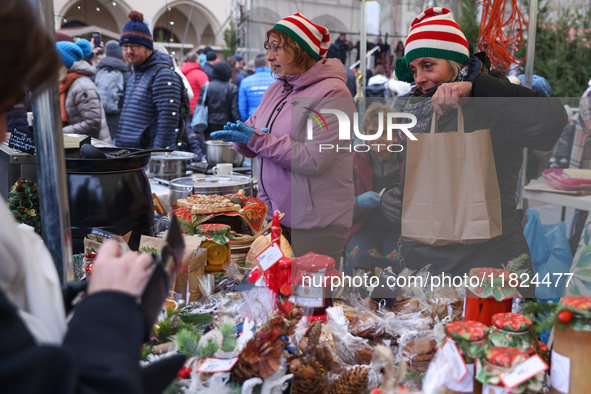 Traditional regional products are sold at Christmas market at the Main Square in Krakow, Poland on Nobember 30th, 2024.  