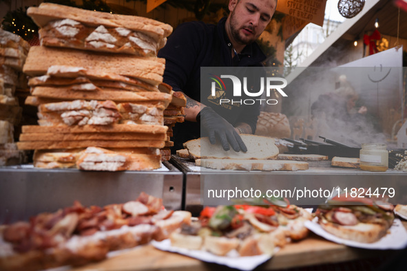 Traditional loaves of bread with lard and topping at Christmas market at the Main Square in Krakow, Poland on Nobember 30th, 2024.  