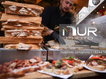 Traditional loaves of bread with lard and topping at Christmas market at the Main Square in Krakow, Poland on Nobember 30th, 2024.  (