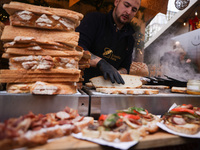 Traditional loaves of bread with lard and topping at Christmas market at the Main Square in Krakow, Poland on Nobember 30th, 2024.  (