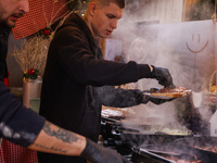 Traditional loaves of bread with lard and topping at Christmas market at the Main Square in Krakow, Poland on Nobember 30th, 2024.  (