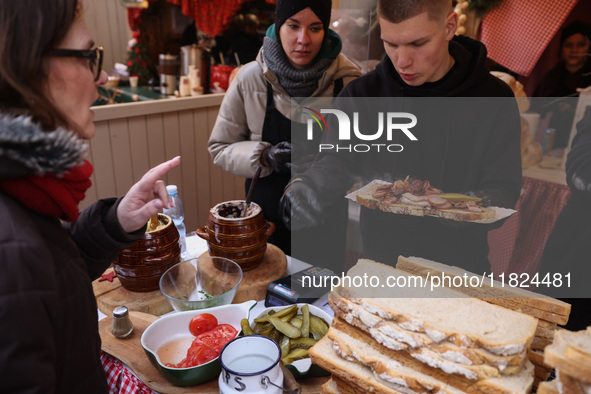 Traditional loaves of bread with lard and topping at Christmas market at the Main Square in Krakow, Poland on Nobember 30th, 2024.  