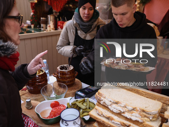 Traditional loaves of bread with lard and topping at Christmas market at the Main Square in Krakow, Poland on Nobember 30th, 2024.  (