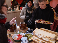 Traditional loaves of bread with lard and topping at Christmas market at the Main Square in Krakow, Poland on Nobember 30th, 2024.  (