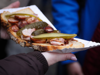 Traditional loaf of bread with lard and topping at Christmas market at the Main Square in Krakow, Poland on Nobember 30th, 2024.  (