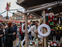 Touriststs visit traditional Christmas market at the Main Square in Krakow, Poland on Nobember 30th, 2024.  (