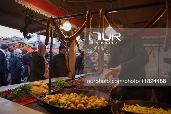 Traditional Polish food is sold at Christmas market at the Main Square in Krakow, Poland on Nobember 30th, 2024.  