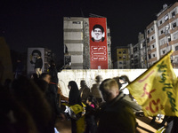 Mourners attend a vigil to honor Hezbollah's late chief Hassan Nasrallah at the site where he was killed in an Israeli air strike in the Har...