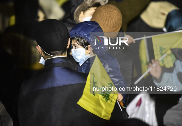 Mourners attend a vigil to honor Hezbollah's late chief Hassan Nasrallah at the site where he was killed in an Israeli air strike in the Har...