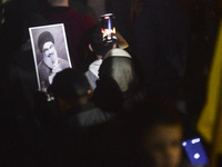 Mourners attend a vigil to honor Hezbollah's late chief Hassan Nasrallah at the site where he was killed in an Israeli air strike in the Har...