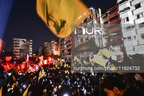 Mourners attend a vigil to honor Hezbollah's late chief Hassan Nasrallah at the site where he was killed in an Israeli air strike in the Har...