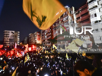 Mourners attend a vigil to honor Hezbollah's late chief Hassan Nasrallah at the site where he was killed in an Israeli air strike in the Har...