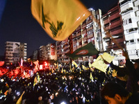 Mourners attend a vigil to honor Hezbollah's late chief Hassan Nasrallah at the site where he was killed in an Israeli air strike in the Har...