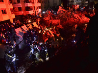 Mourners attend a vigil to honor Hezbollah's late chief Hassan Nasrallah at the site where he was killed in an Israeli air strike in the Har...