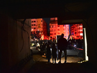 Mourners attend a vigil to honor Hezbollah's late chief Hassan Nasrallah at the site where he was killed in an Israeli air strike in the Har...