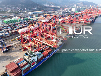 Cargo ships dock to load and unload containers at a container terminal in Lianyungang Port in Lianyungang, China, on December 1, 2024. (