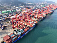 Cargo ships dock to load and unload containers at a container terminal in Lianyungang Port in Lianyungang, China, on December 1, 2024. (