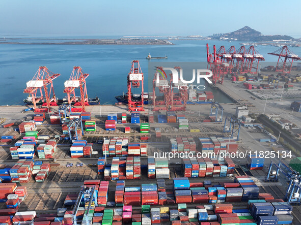 Cargo ships dock at the Lianyungang packing terminal to load and unload containers in Lianyungang, China, on December 1, 2024. 