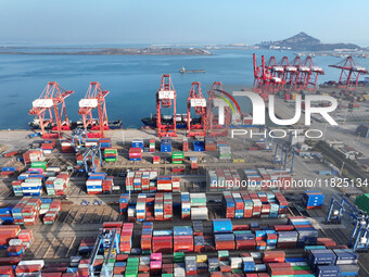 Cargo ships dock at the Lianyungang packing terminal to load and unload containers in Lianyungang, China, on December 1, 2024. (