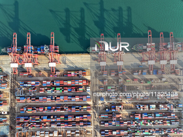 Cargo ships dock at the Lianyungang packing terminal to load and unload containers in Lianyungang, China, on December 1, 2024. 