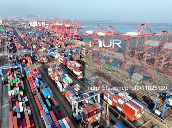 Cargo ships dock at the Lianyungang packing terminal to load and unload containers in Lianyungang, China, on December 1, 2024. 