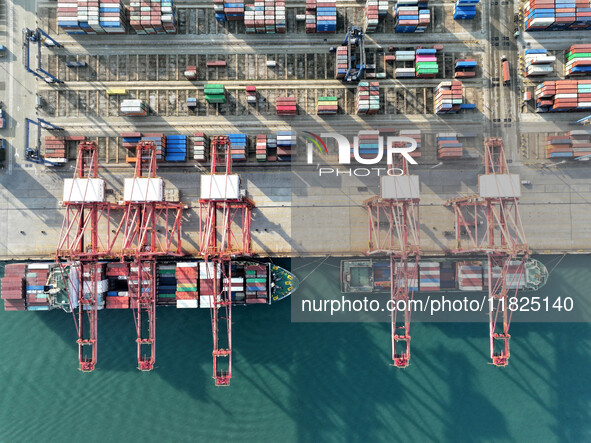 Cargo ships dock at the Lianyungang packing terminal to load and unload containers in Lianyungang, China, on December 1, 2024. 