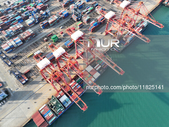 Cargo ships dock at the Lianyungang packing terminal to load and unload containers in Lianyungang, China, on December 1, 2024. 