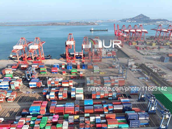 Cargo ships dock at the Lianyungang packing terminal to load and unload containers in Lianyungang, China, on December 1, 2024. 