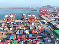 Cargo ships dock at the Lianyungang packing terminal to load and unload containers in Lianyungang, China, on December 1, 2024. (