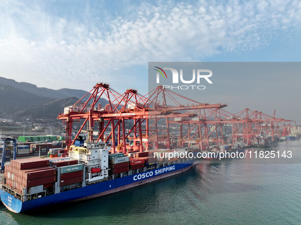 Cargo ships dock at the Lianyungang packing terminal to load and unload containers in Lianyungang, China, on December 1, 2024. 