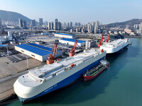 Roll-on wheels load export cars at the Lianyungang port in Lianyungang, Jiangsu province, China, on December 1, 2024. (