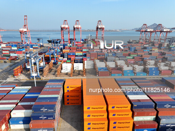 Cargo ships dock at the Lianyungang packing terminal to load and unload containers in Lianyungang, China, on December 1, 2024. 