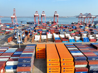 Cargo ships dock at the Lianyungang packing terminal to load and unload containers in Lianyungang, China, on December 1, 2024. (