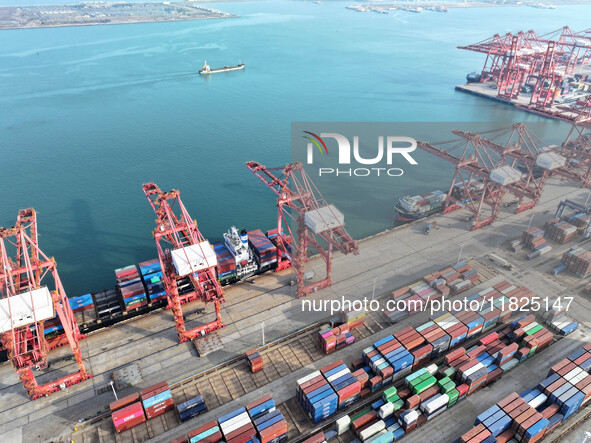 Cargo ships dock at the Lianyungang packing terminal to load and unload containers in Lianyungang, China, on December 1, 2024. 