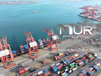 Cargo ships dock at the Lianyungang packing terminal to load and unload containers in Lianyungang, China, on December 1, 2024. (