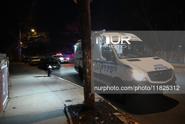 NYPD crime scene investigators search for evidence at the scene where a 30-year-old man is killed in an assault in the Throggs Neck section...