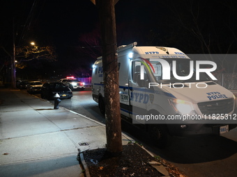 NYPD crime scene investigators search for evidence at the scene where a 30-year-old man is killed in an assault in the Throggs Neck section...