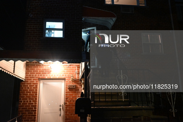 NYPD crime scene investigators search for evidence at the scene where a 30-year-old man is killed in an assault in the Throggs Neck section...