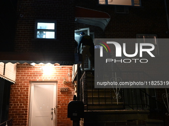 NYPD crime scene investigators search for evidence at the scene where a 30-year-old man is killed in an assault in the Throggs Neck section...