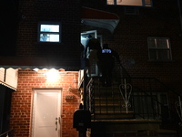 NYPD crime scene investigators search for evidence at the scene where a 30-year-old man is killed in an assault in the Throggs Neck section...