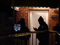 NYPD crime scene investigators search for evidence at the scene where a 30-year-old man is killed in an assault in the Throggs Neck section...