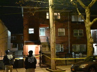 NYPD crime scene investigators search for evidence at the scene where a 30-year-old man is killed in an assault in the Throggs Neck section...