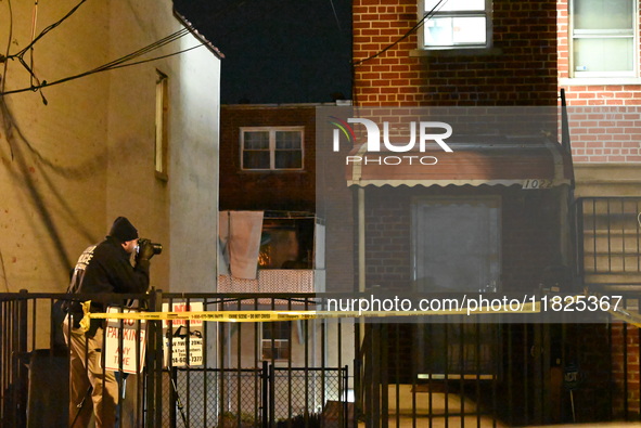 NYPD crime scene investigators search for evidence at the scene where a 30-year-old man is killed in an assault in the Throggs Neck section...