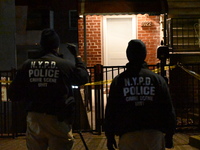 NYPD crime scene investigators search for evidence at the scene where a 30-year-old man is killed in an assault in the Throggs Neck section...